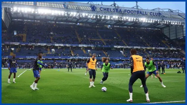 Chelsea players warm up at Stamford Bridge.