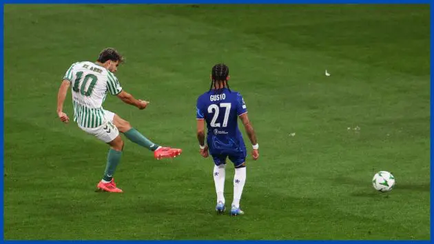 Ez Abde fires in Betis' goal while Malo Gusto watches on.