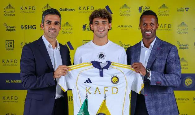 Joao Felix holding up an Al Nassr shirt.