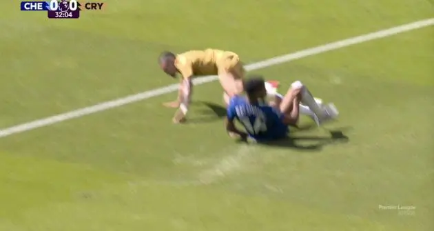 Josh Acheampong makes a tackle on Daniel Munoz.