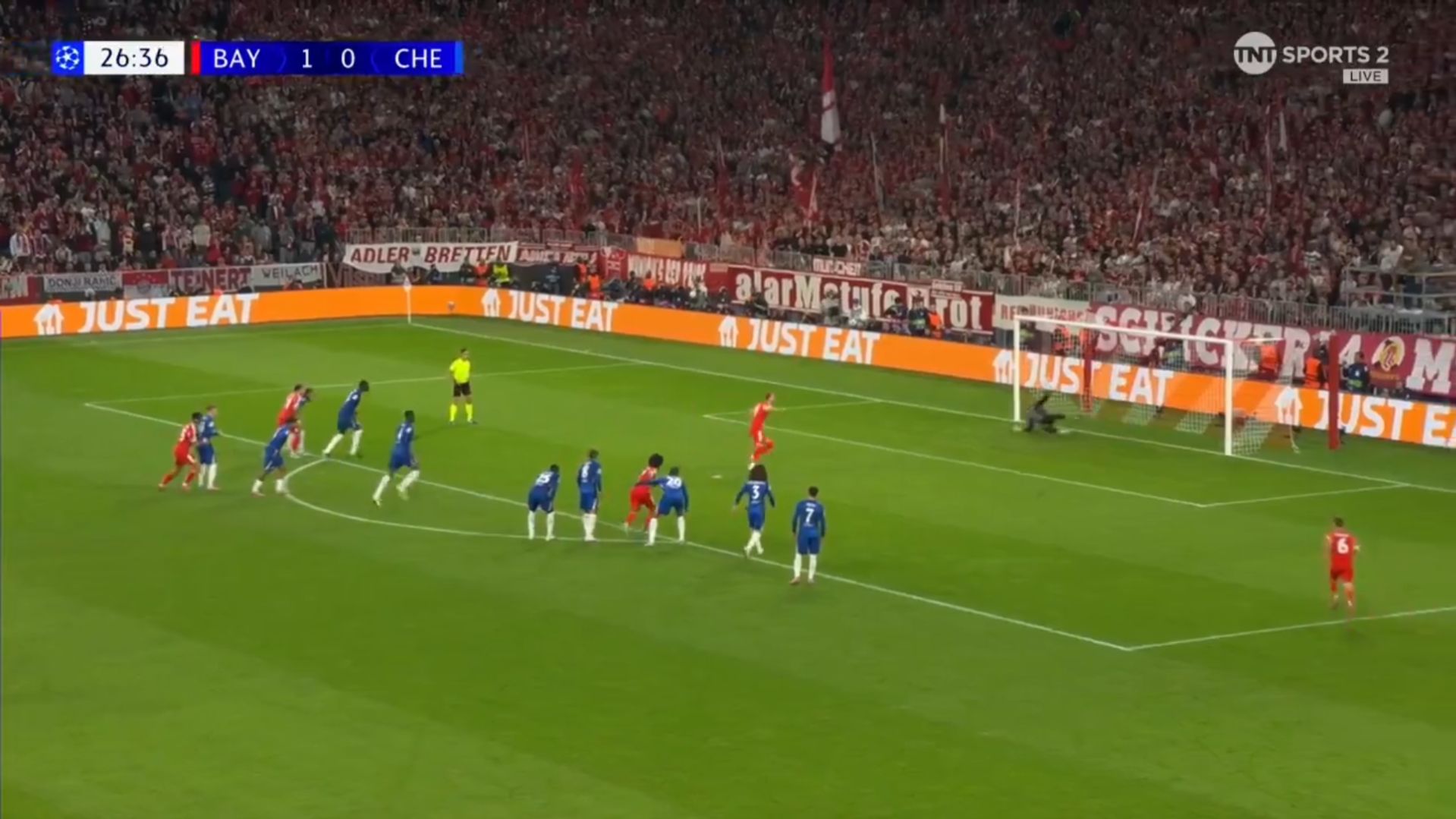 Harry Kane knocks in his penalty against Chelsea.