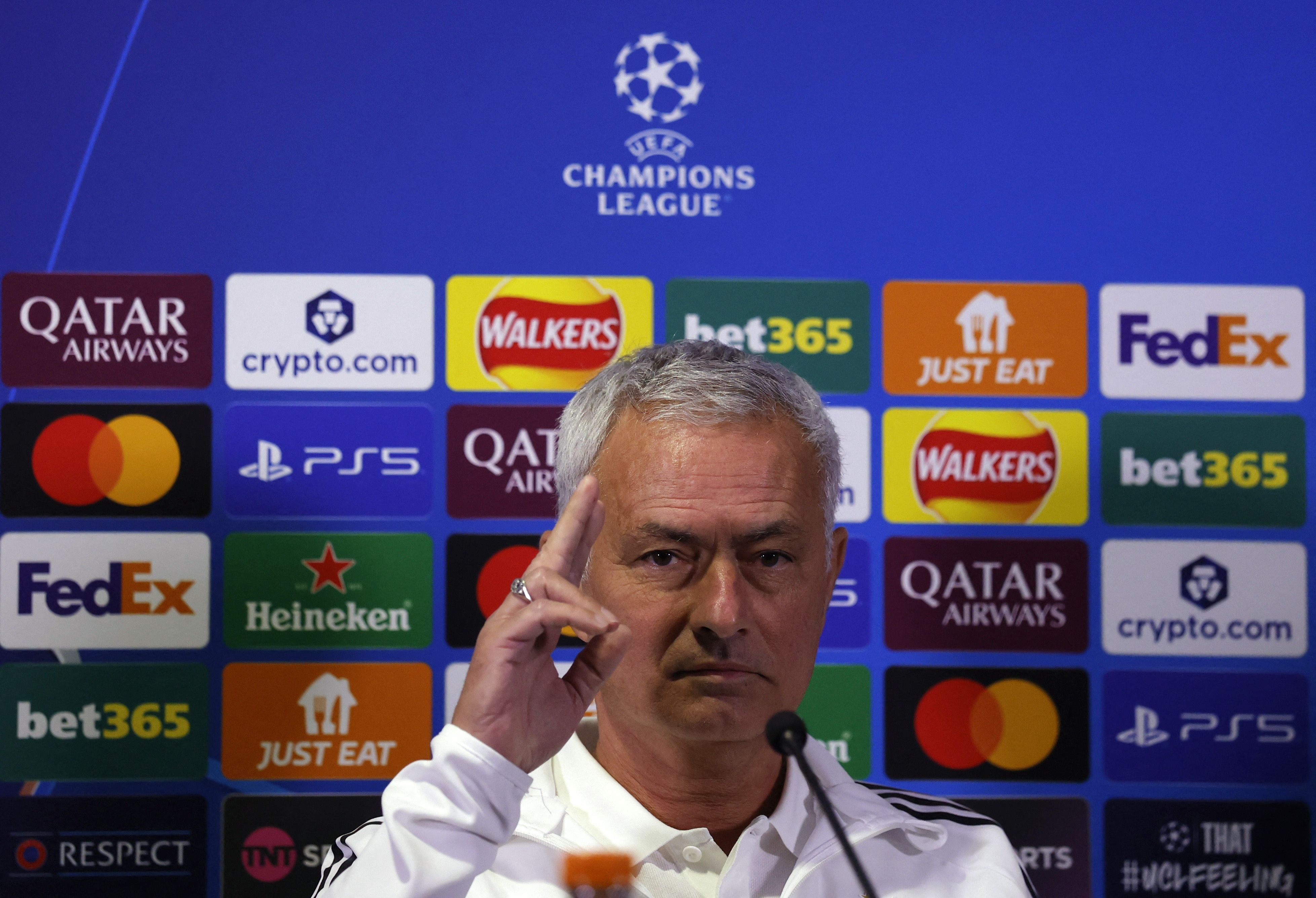 Jose Mourinho holds up 3 fingers for 3 titles at Chelsea.