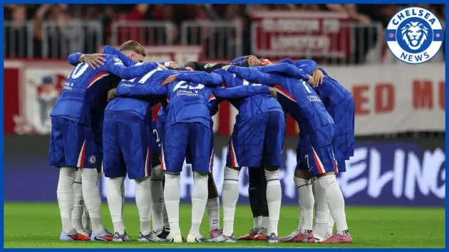 A Chelsea squad group huddle in the Allianz.
