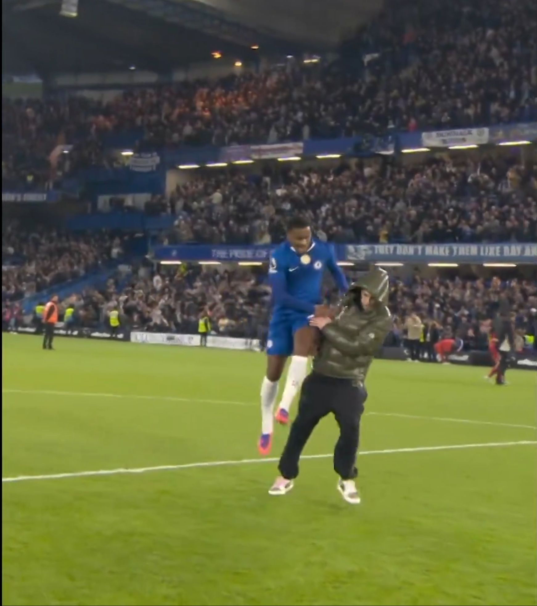 Cole Palmer reacts to being jumped on by Jorrel Hato at full time after the Liverpool win.