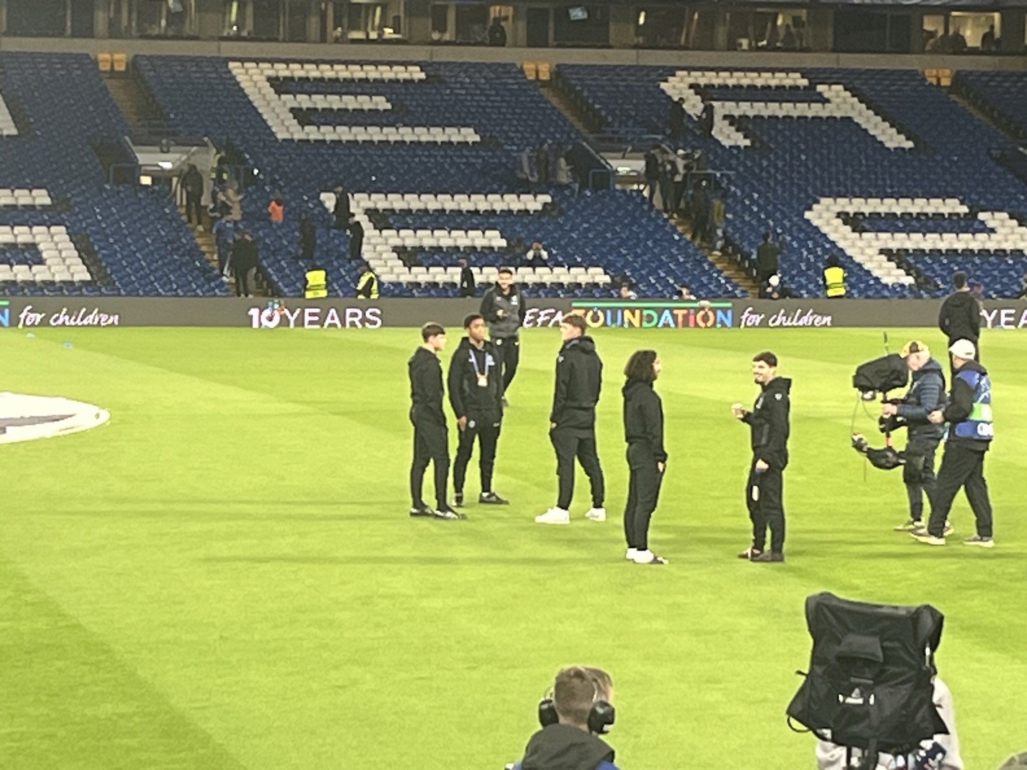 Various Chelsea youngsters including Ryan Kavuma-McQueen on the pitch at Stamford Bridge.