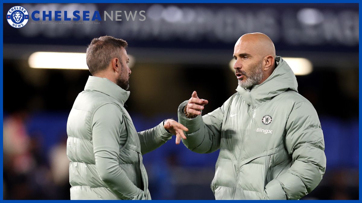 Enzo Maresca speaks with assistant coach Robert Vitiello at Stamford Bridge.