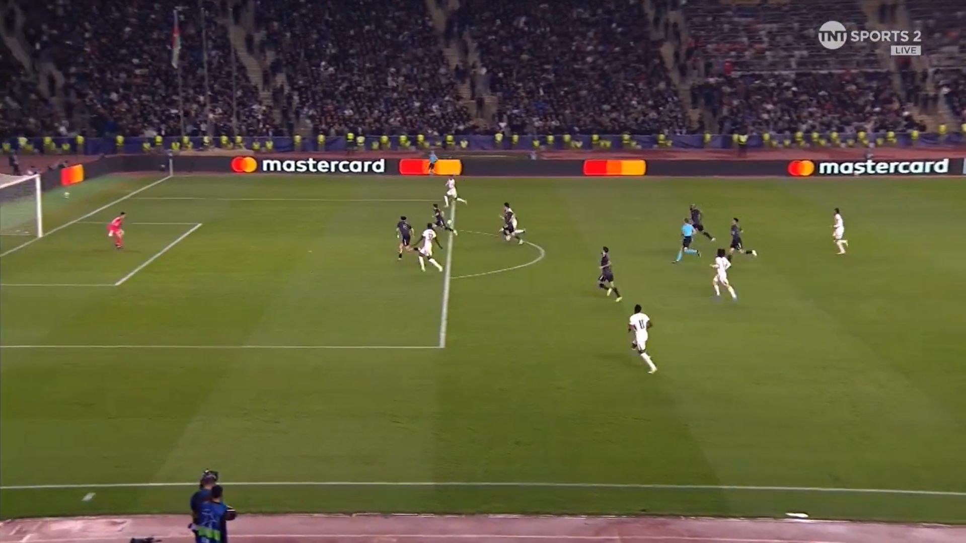 Santos slips in Estevao for the assist.