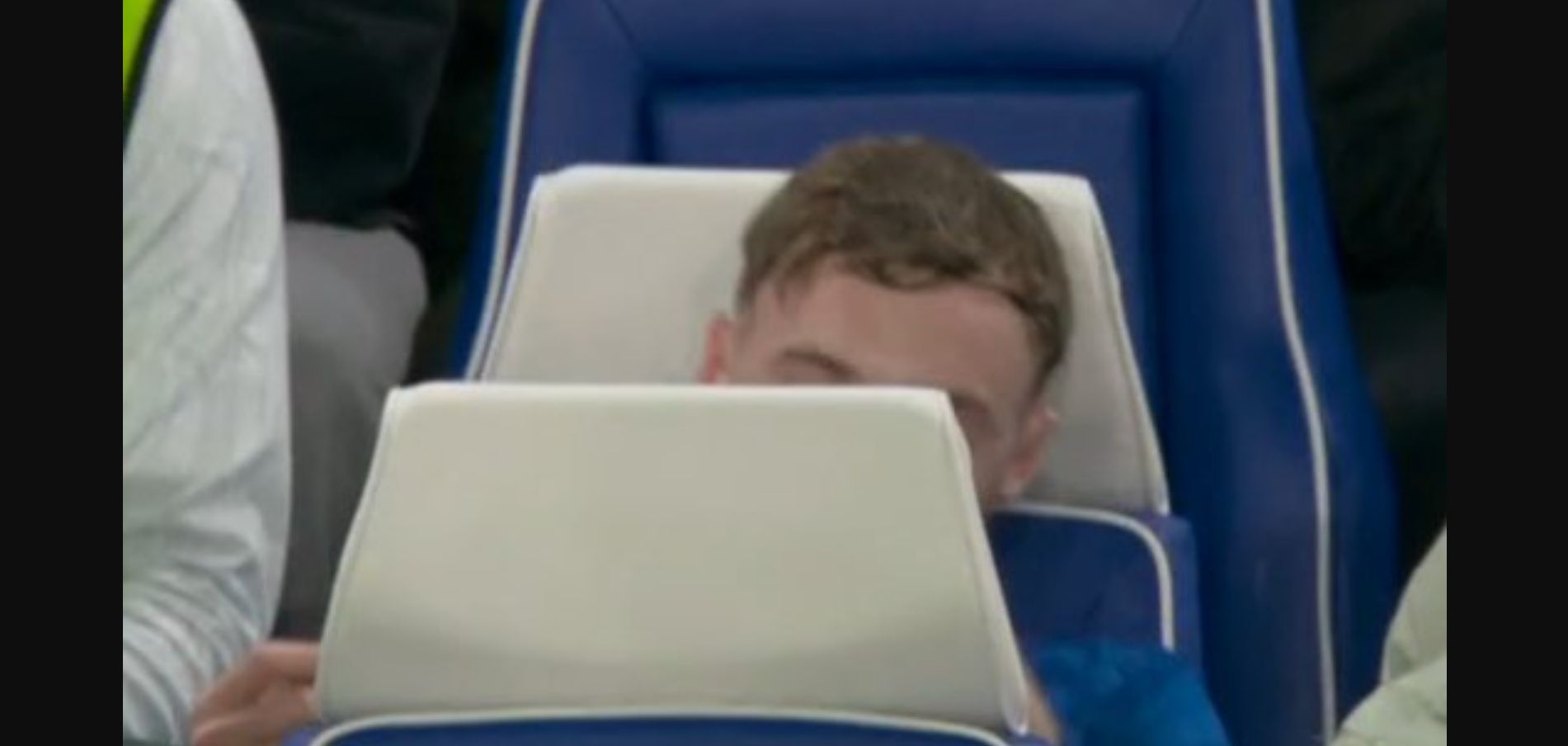 Cole Palmer sits on the bench after being subbed off.