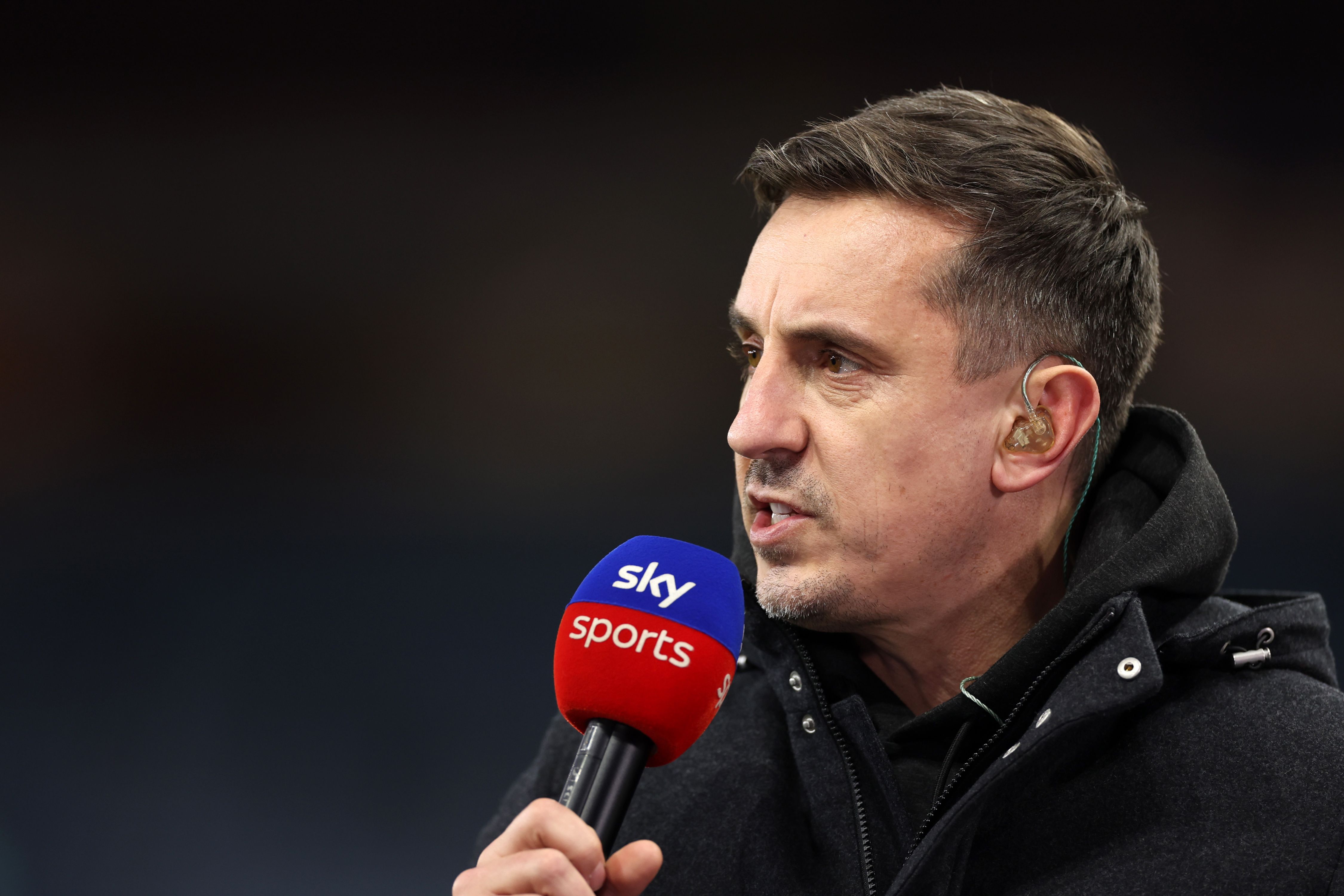 Gary Neville doing punditry for Sky.