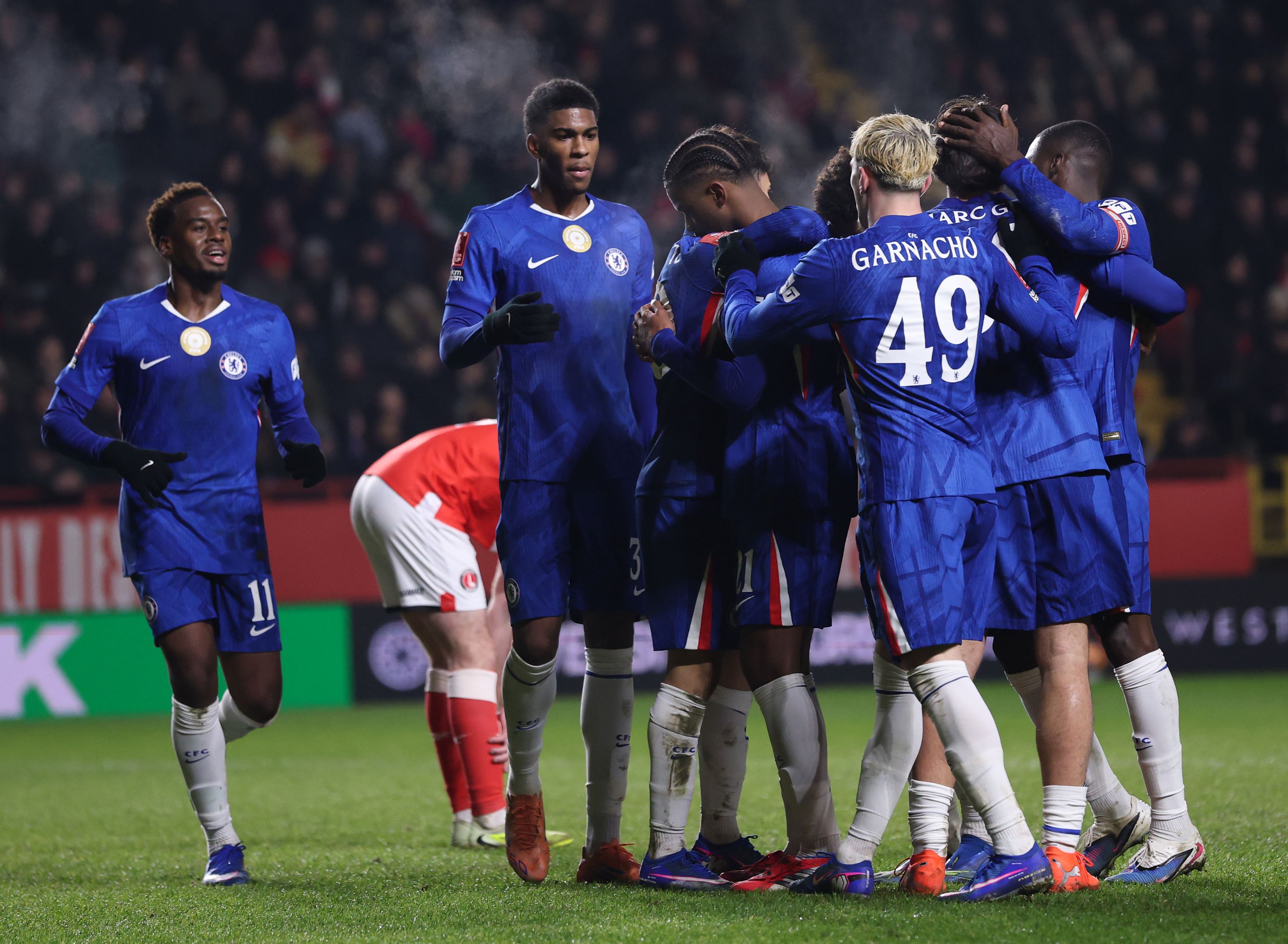Chelsea players celebrate goal against Charlton.