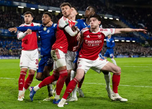 Chelsea and Arsenal players compete for the ball.