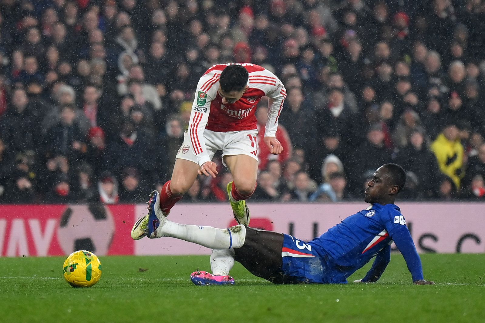 Trevoh Chalobah battles for possession against Arsenal.