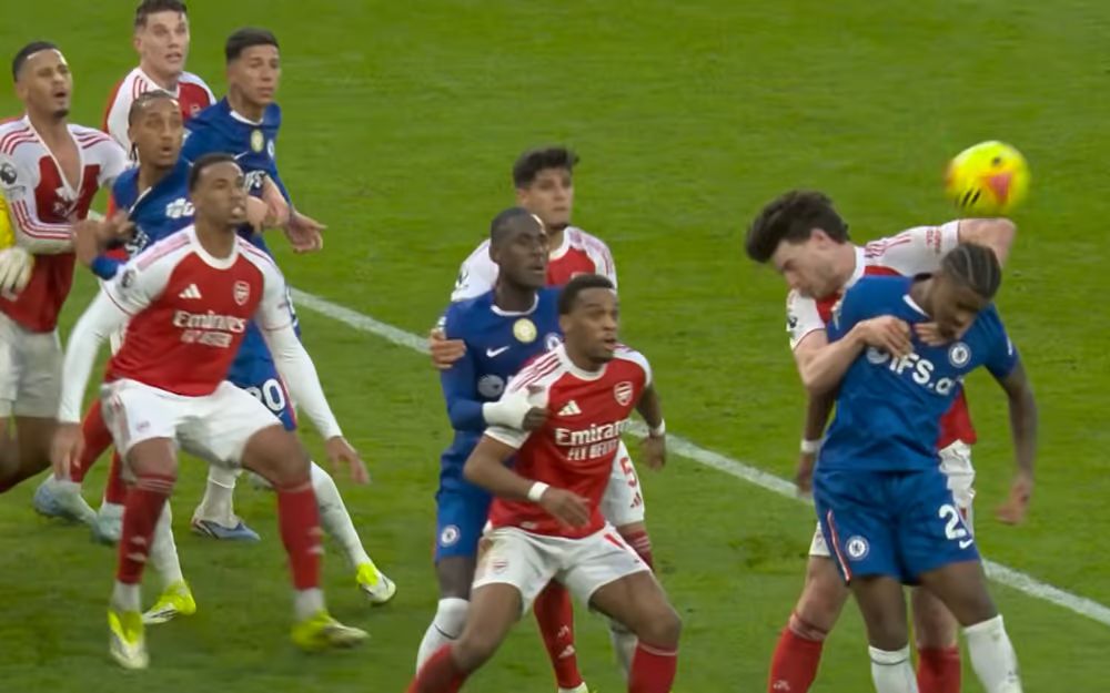 Declan Rice handballs the ball while fouling Jorrel Hato.