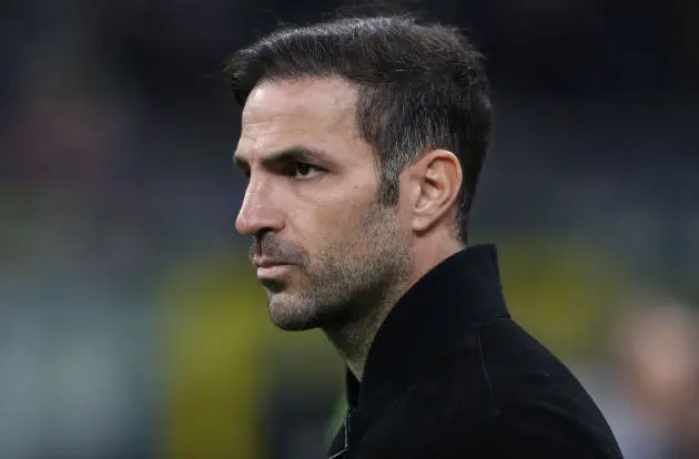 Cesc Fabregas looks on from the touchline.
