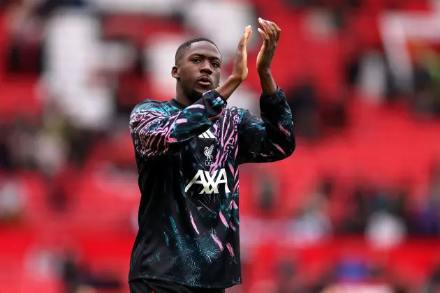 Ibrahima Konate applauds the Liverpool fans.