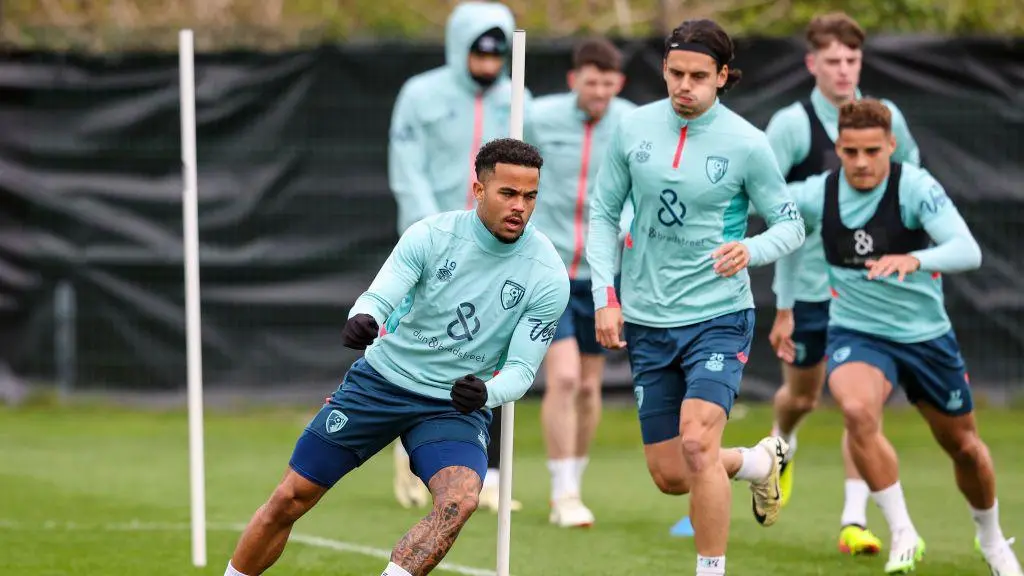 Bournemouth players training during a pre-season camp on the pitch.