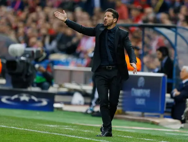 Diego Simeone coaching on the sidelines during a match.