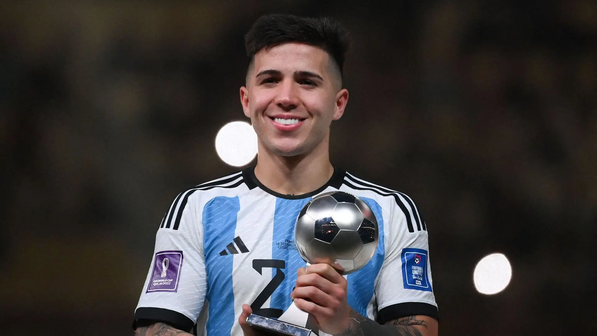 Enzo Fernandez of Argentina holding a trophy during the World Cup celebration.