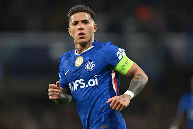Enzo Fernandez in Chelsea FC blue kit, wearing captain's armband during a match.