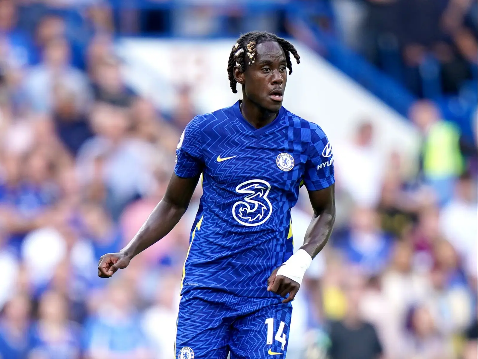 Trevoh Chalobah playing for Chelsea in a blue jersey at a match.