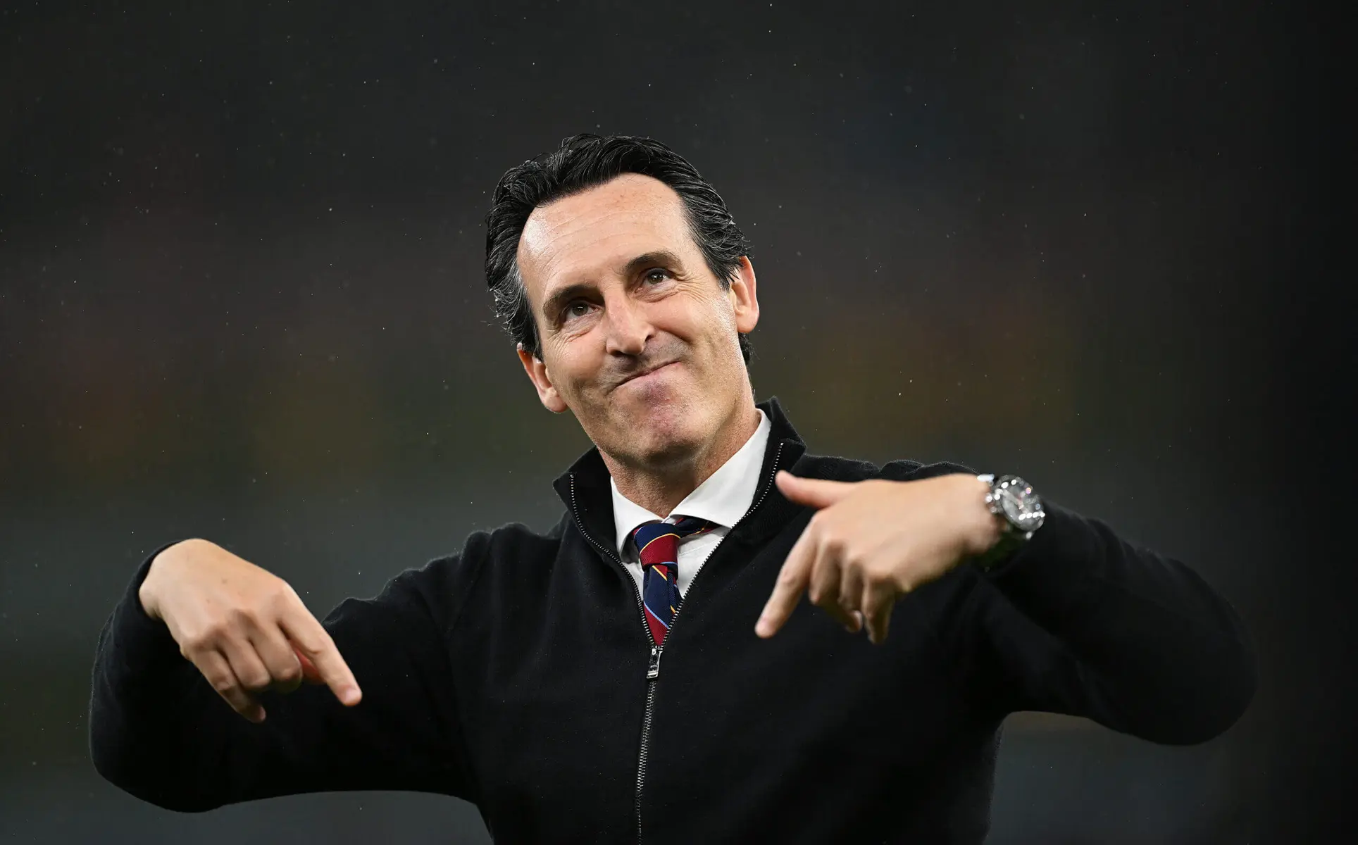 Unai Emery, Aston Villa manager, smiling and gesturing during a match.