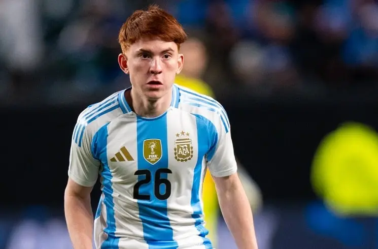 Young soccer player wearing Argentina jersey with number 26 during a match.