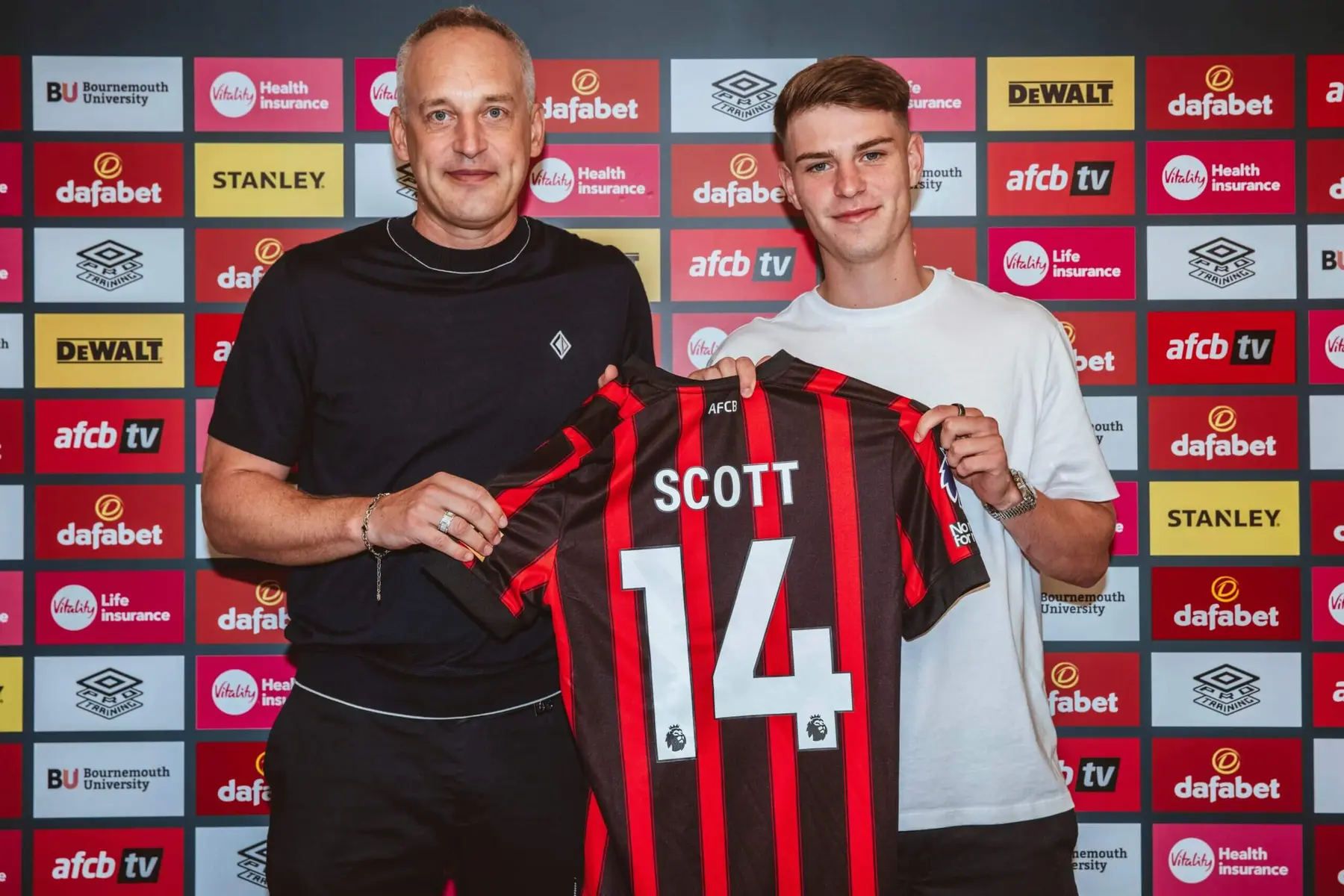 Alex Scott posing with a Bournemouth AFC jersey featuring his name and number 14