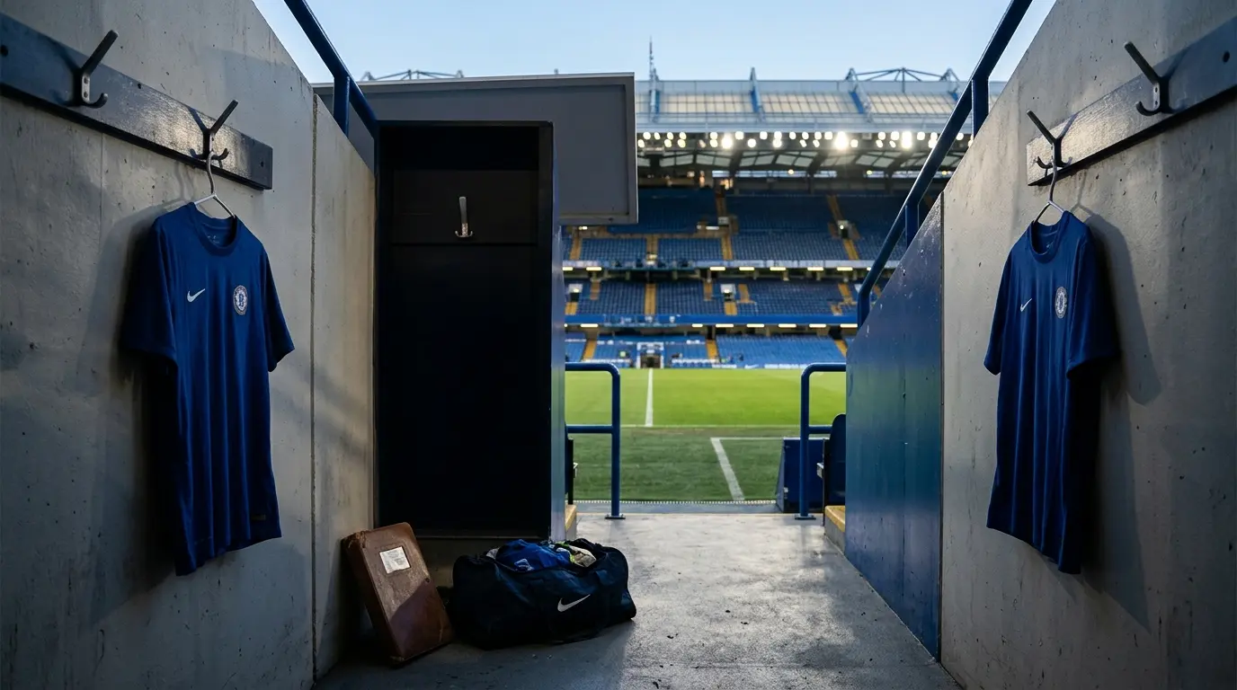 Empty Chelsea stadium tunnel with departing players’ blue shirts symbolizing squad reduction and transfers