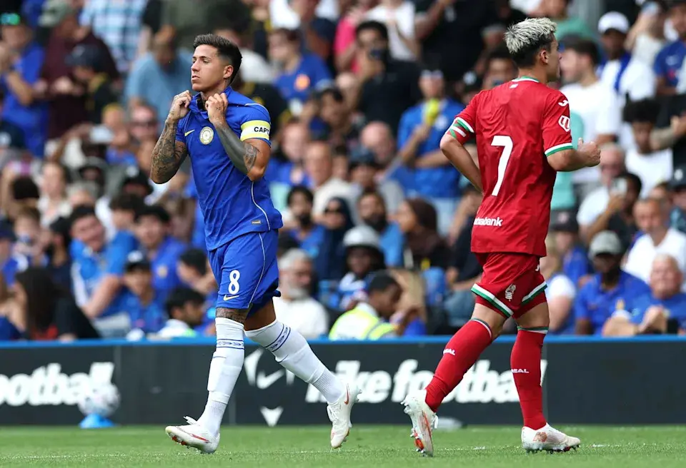 Enzo Fernandez in a blue Chelsea kit wearing a captain's armband during a match