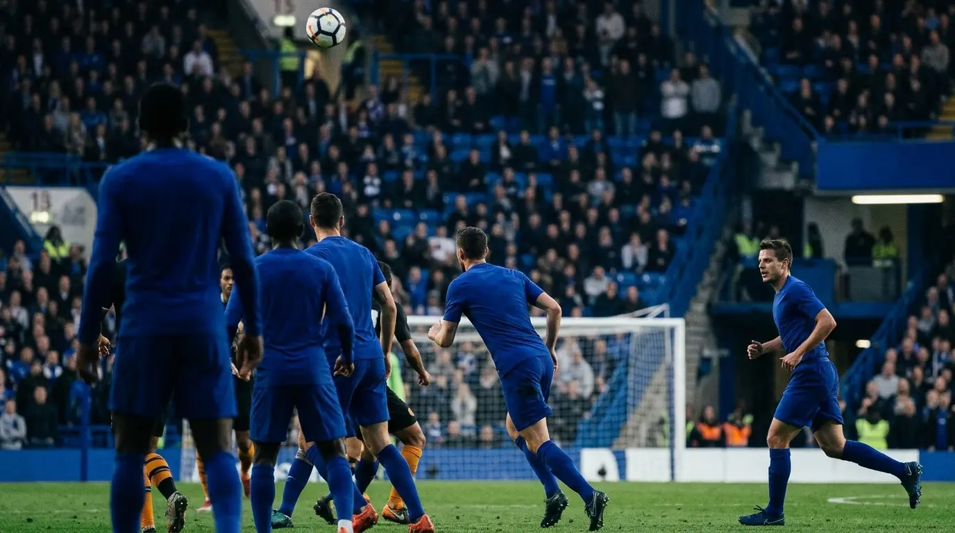 Chelsea defenders track a bouncing ball in the penalty area during a tense Stamford Bridge match