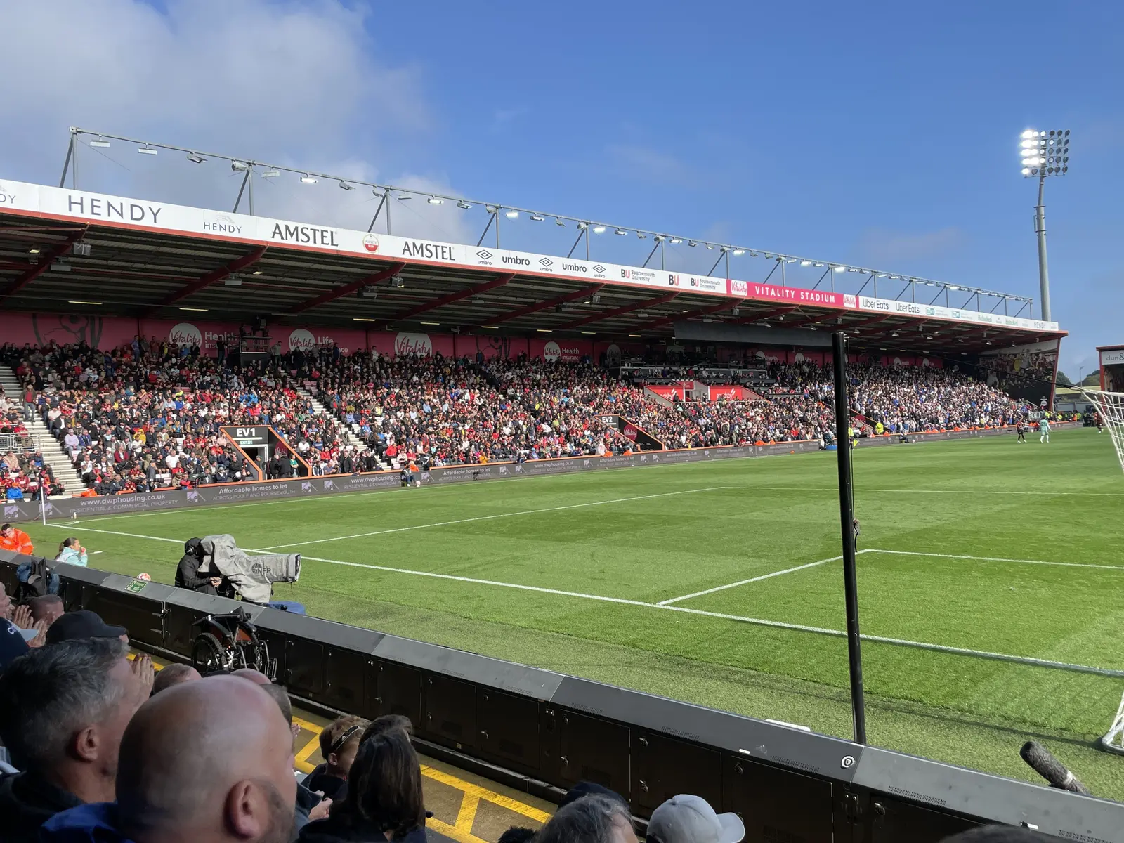 A wide shot of the East Stand at Vitality Stadium with spectators in the stands during a match.