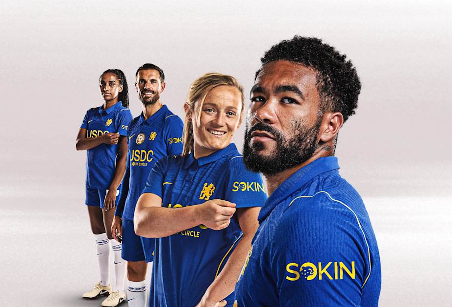 Chelsea players wearing the blue home shirt with the Sokin logo on the sleeve